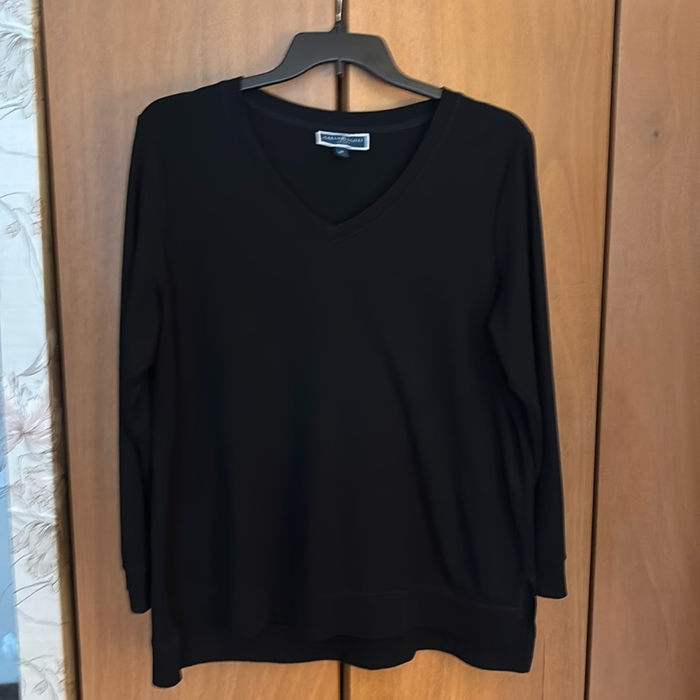 Soft sweater-like material, shirt size 1x.